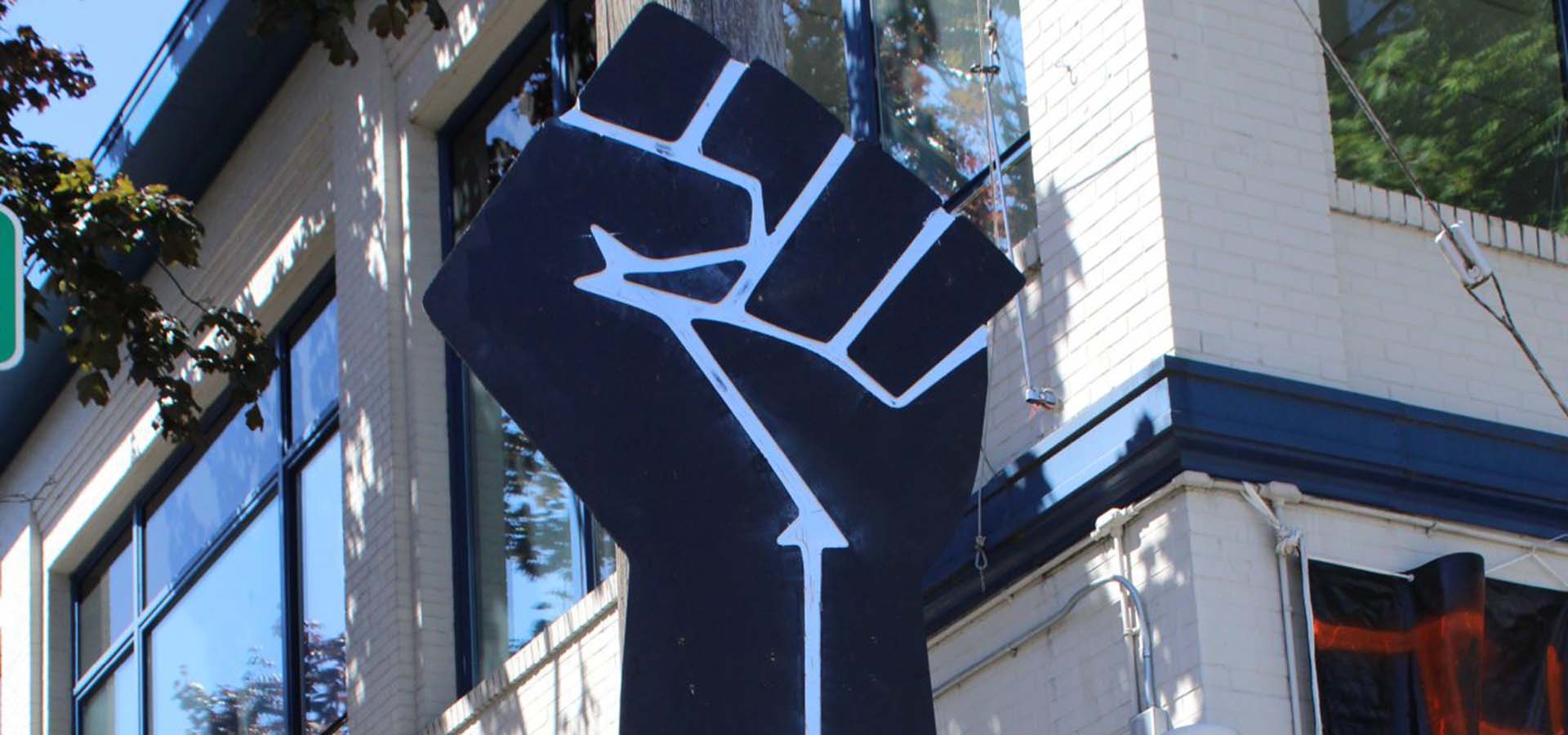 Black Lives Matter art of giant black fist in the air.