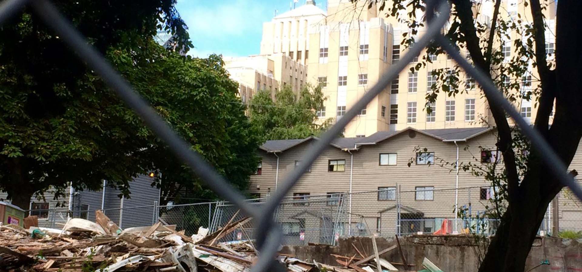 Demolition of a building with the debris on the ground.