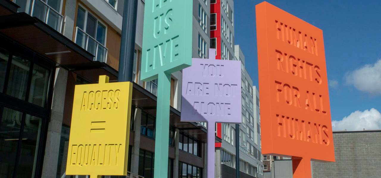 Colorful signs along the AIDS memorial path in Seattle.