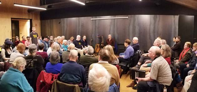 People singing together in a room.