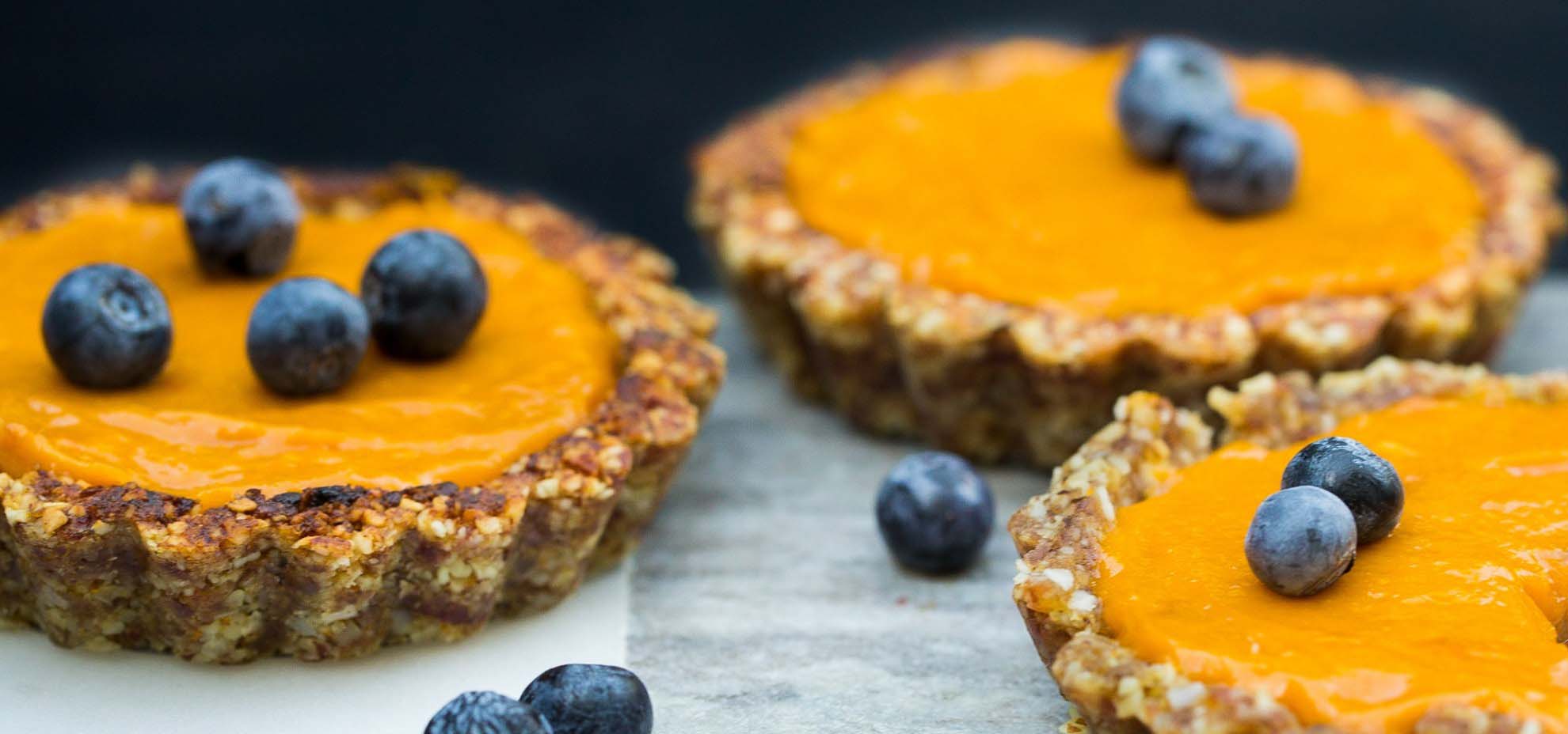 Mango and ginger tarts topped with blueberries.