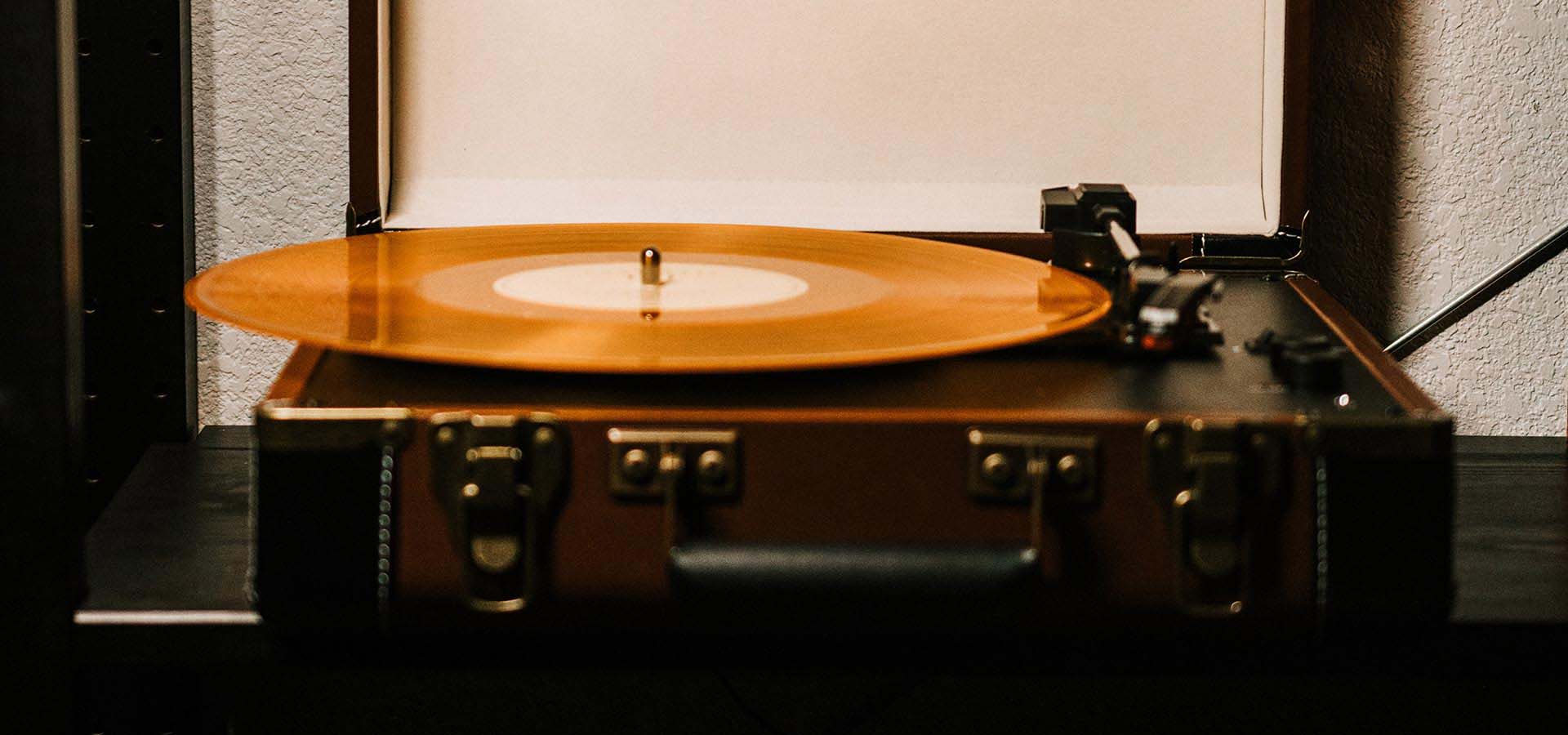 Record player with a gold record on top.