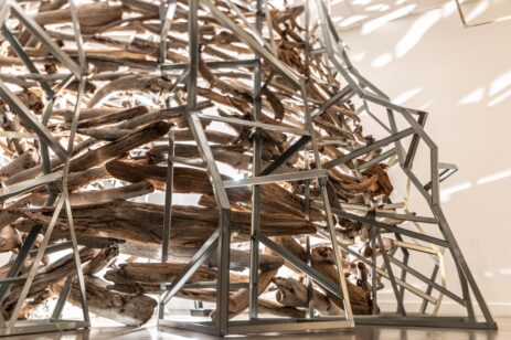 Abstract art structure made of metal and driftwood.