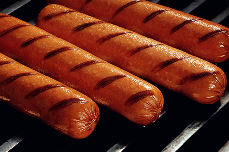 hot dogs on grill