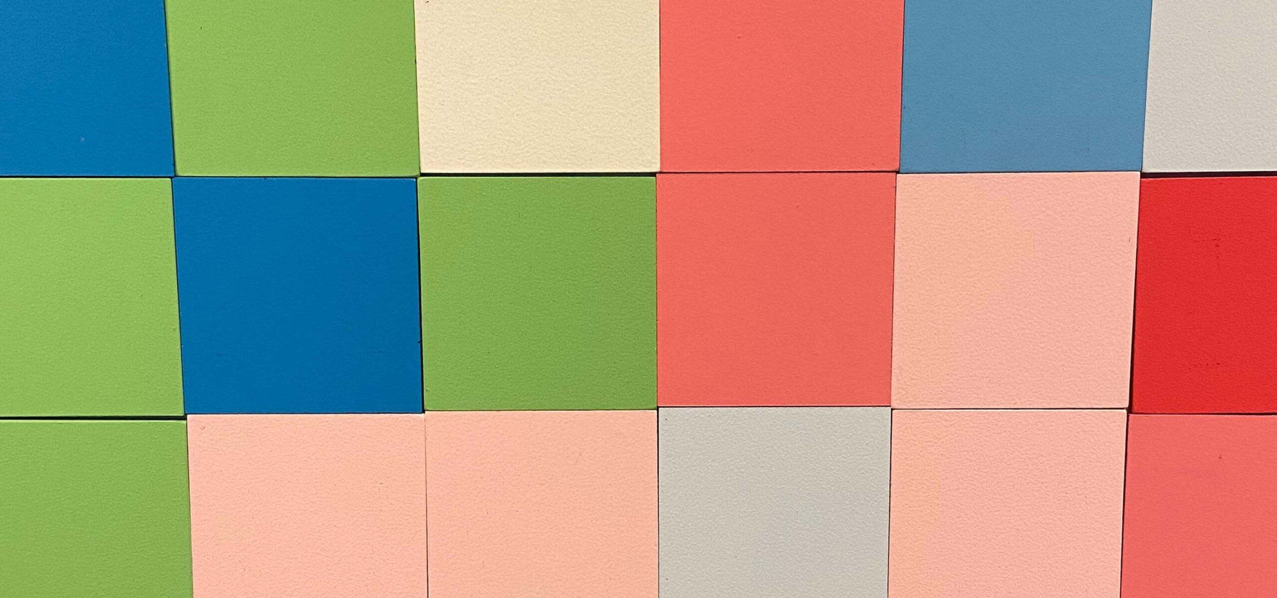 Up close photo of colorful block tiles.