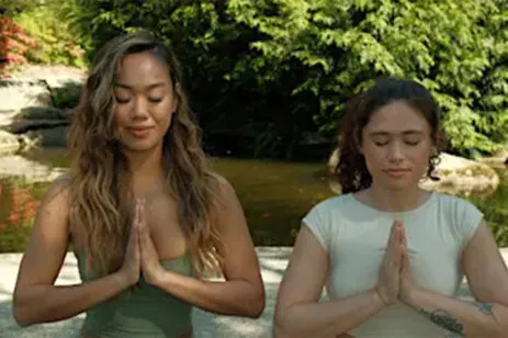 two people meditating
