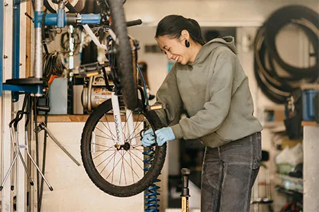 woman fixing bike