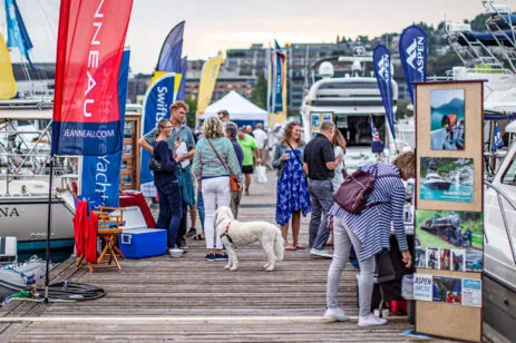boat show attendees on pier