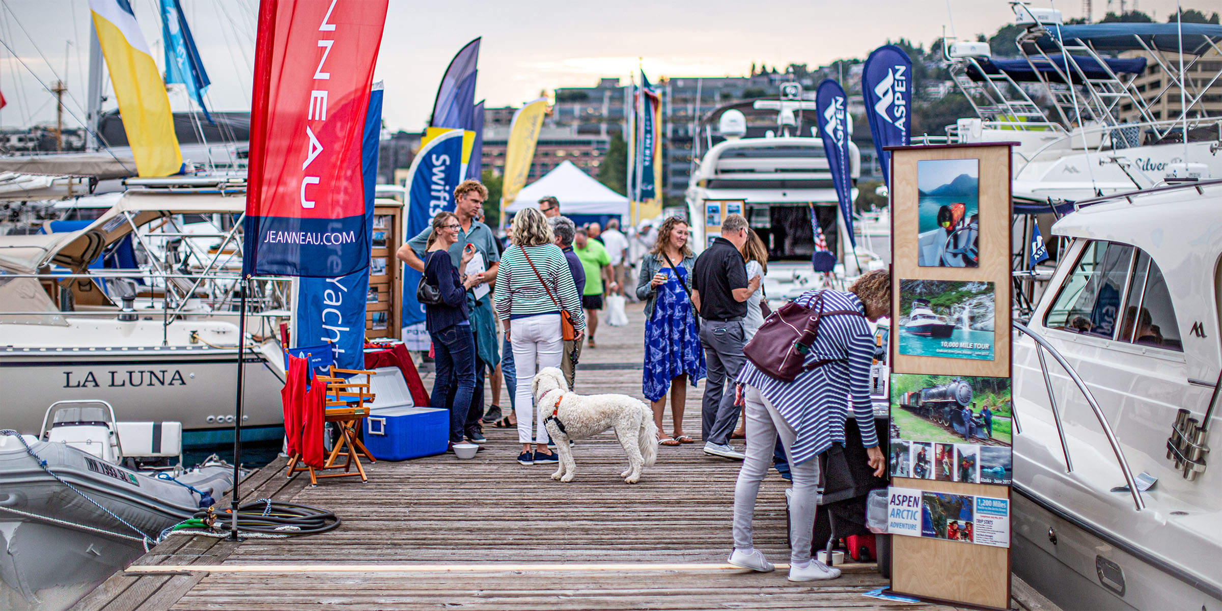 boat show attendees on pier