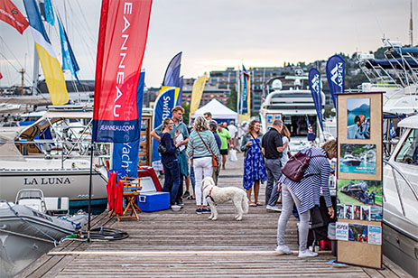 boat show attendees on pier
