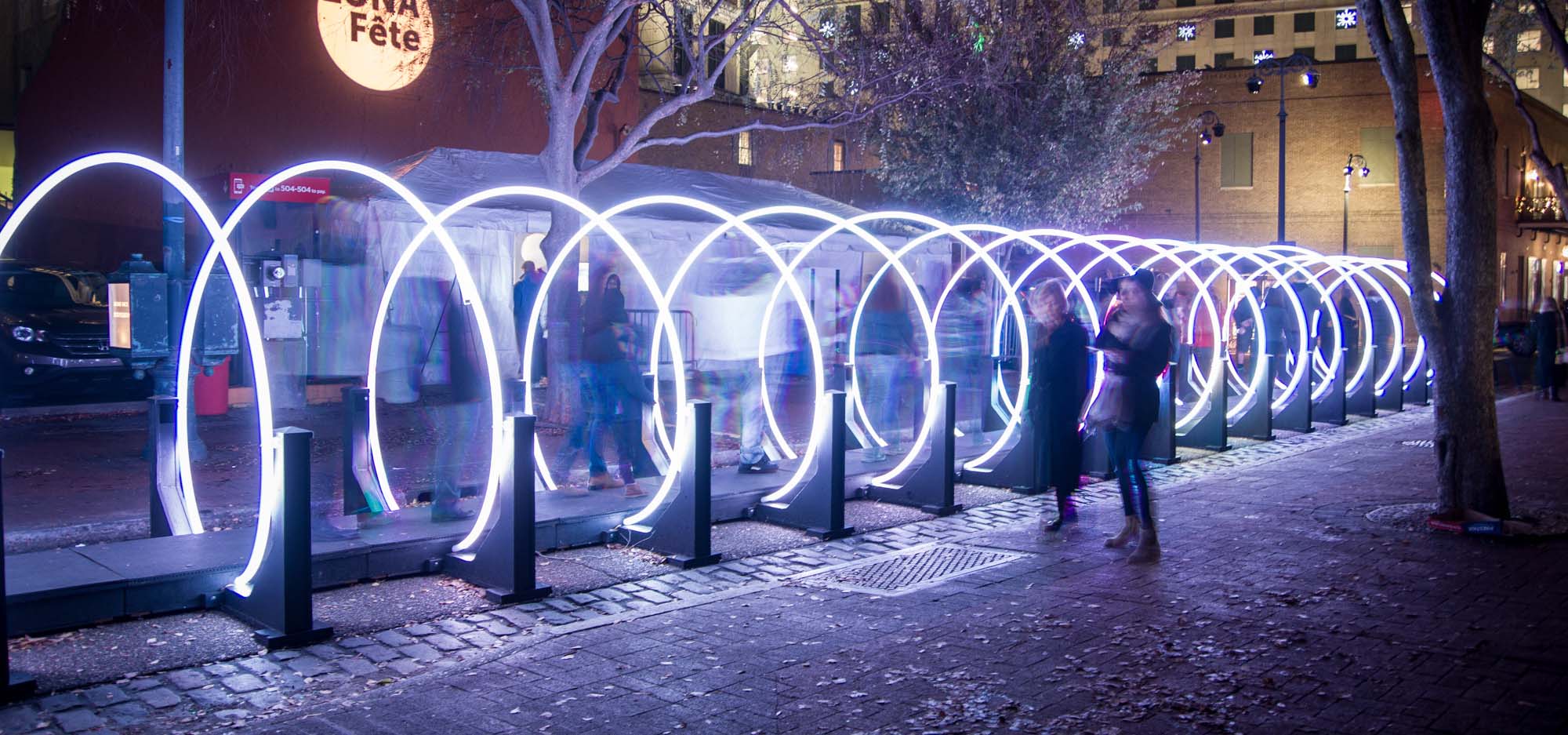 Outdoor art installations that are a lit up tube to walk through at night.