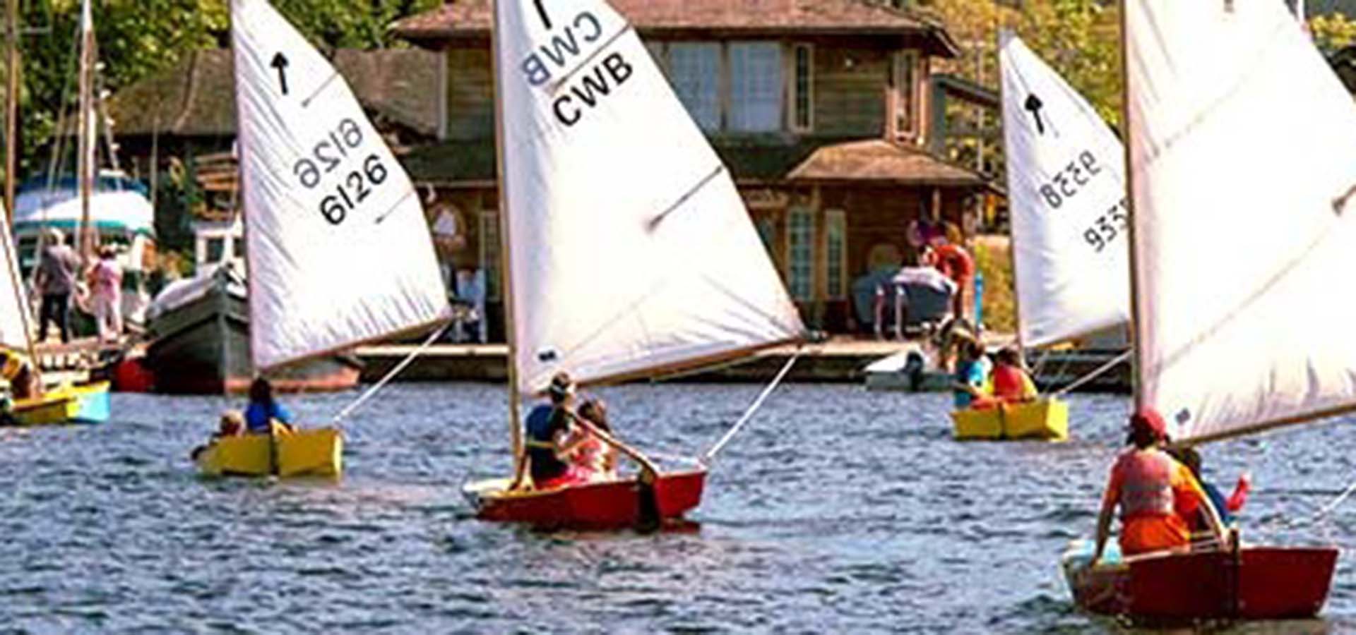 Small wooden boats sailing on South Lake Union