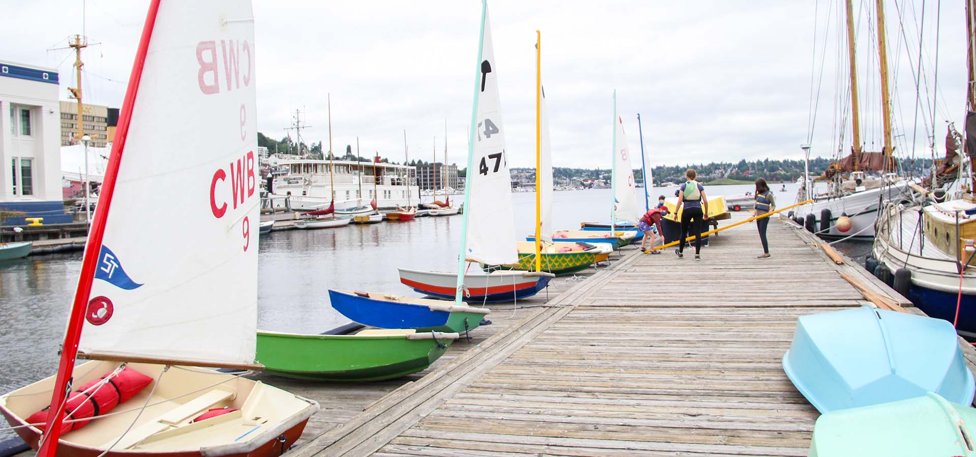 Row of small boats moored at a dock