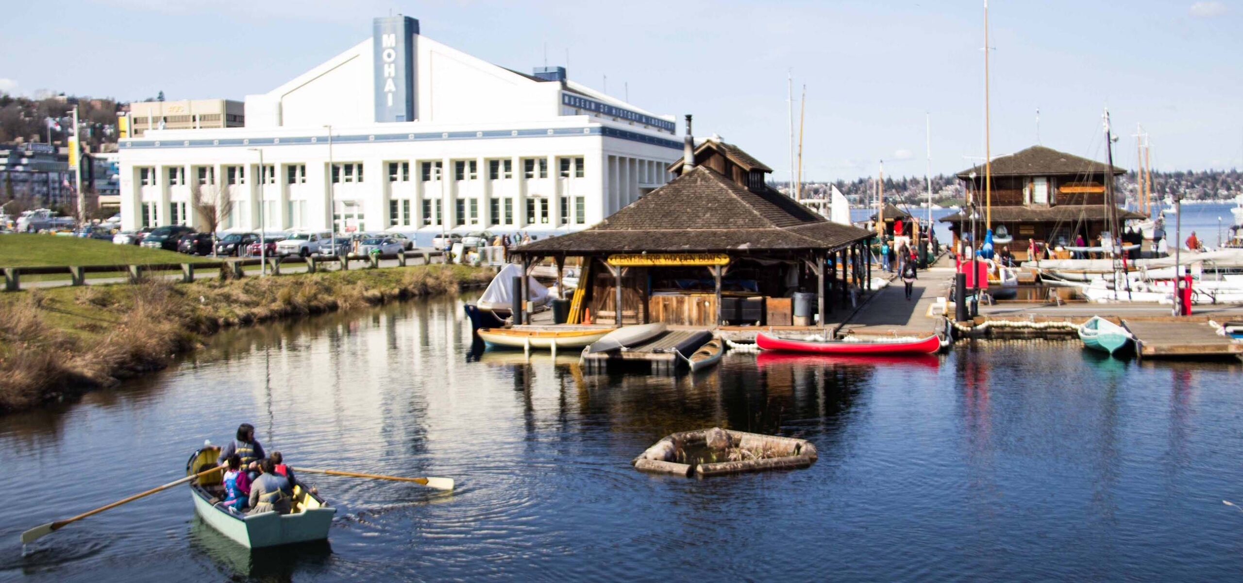 The Center for Wooden Boats Wagner floating home in front of MOHAI.