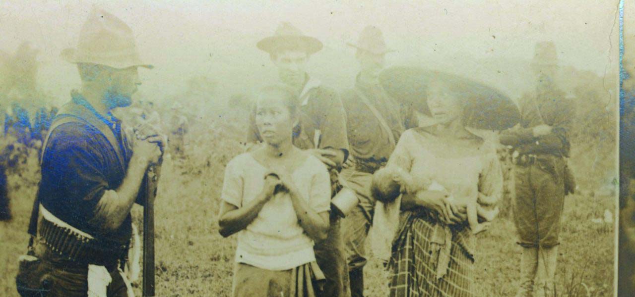 Old photo of Carlos Bulosan with natives.