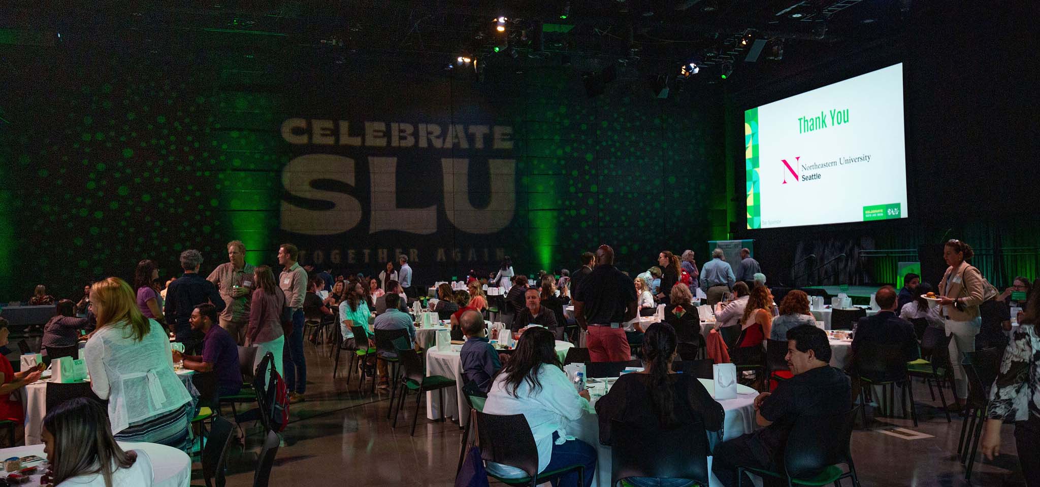 An event with people seated at tables.