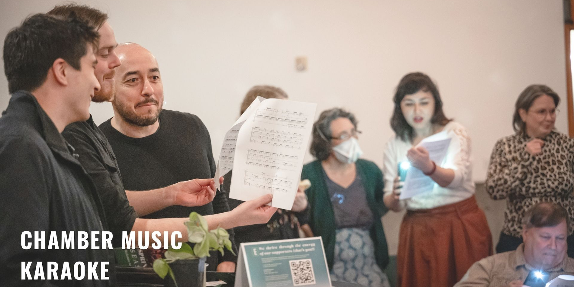 people looking at sheet music