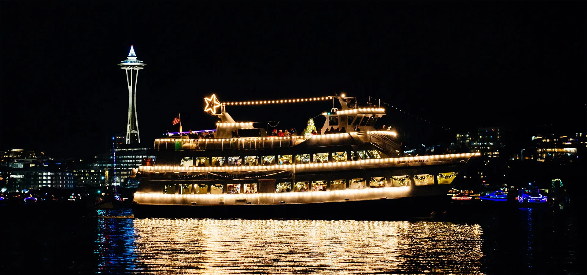 ship on lake union with holiday lights