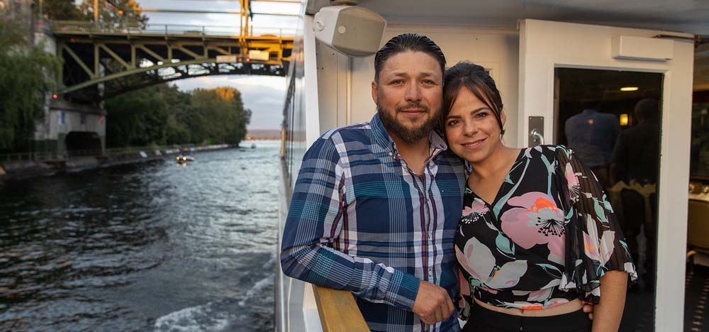 A couple embracing on a cruise ship.