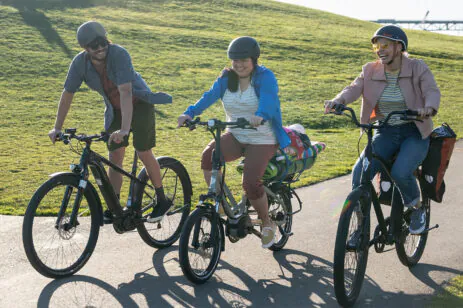 three people biking