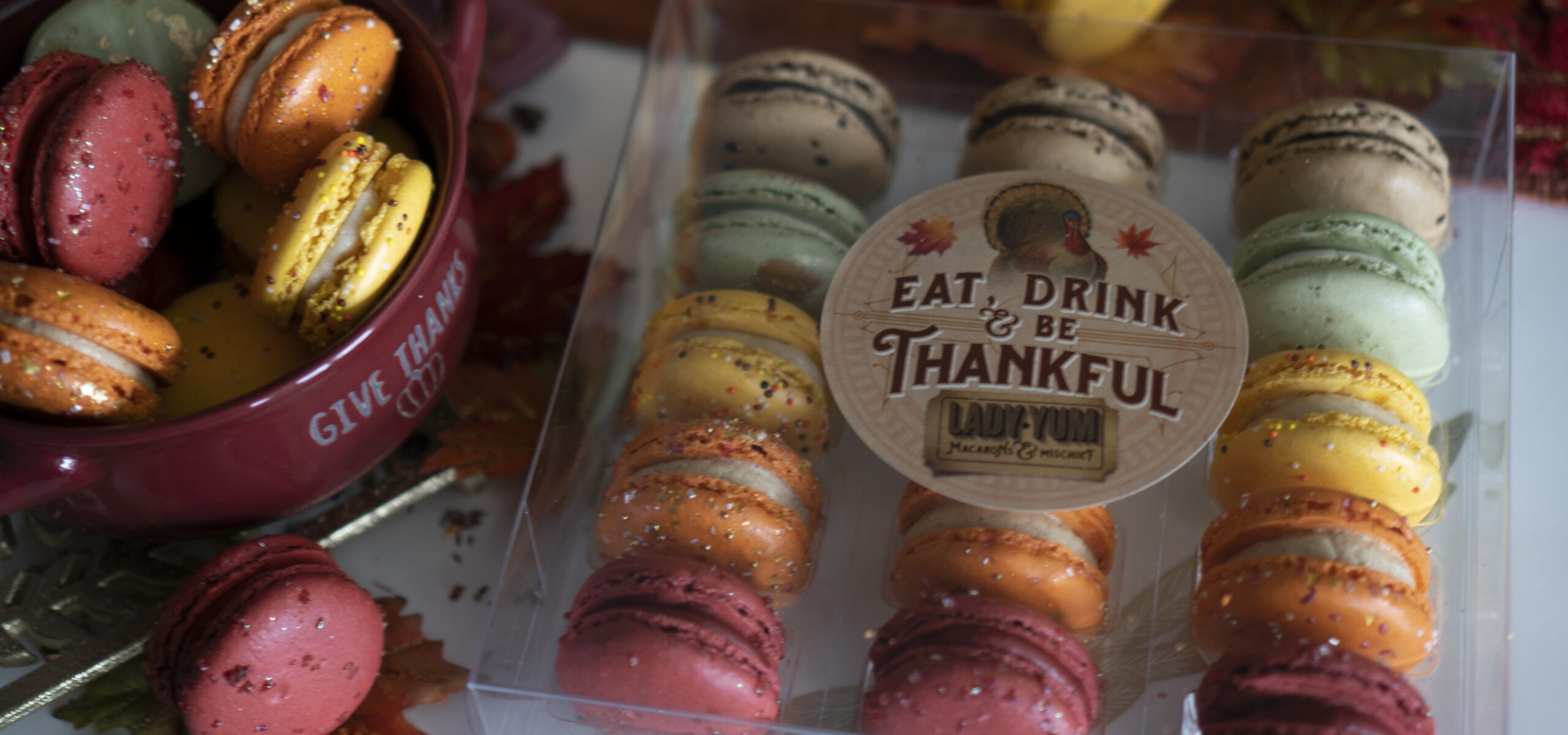 Package of fall flavored macarons in fall colors.