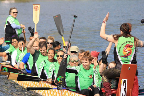 people in boat rowing