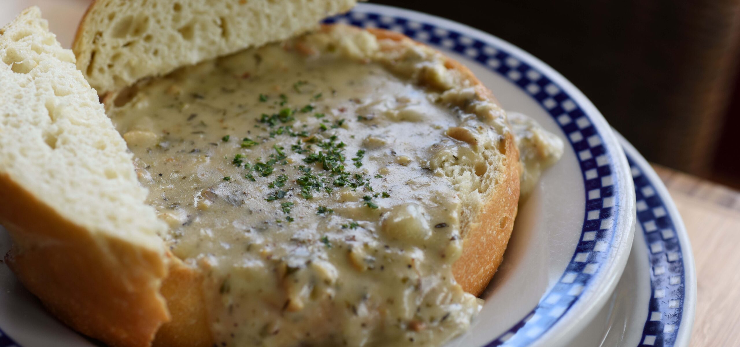 Bread bowl filled with clam chowder.