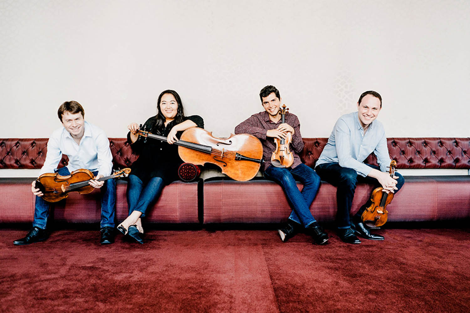 four musicians on couch