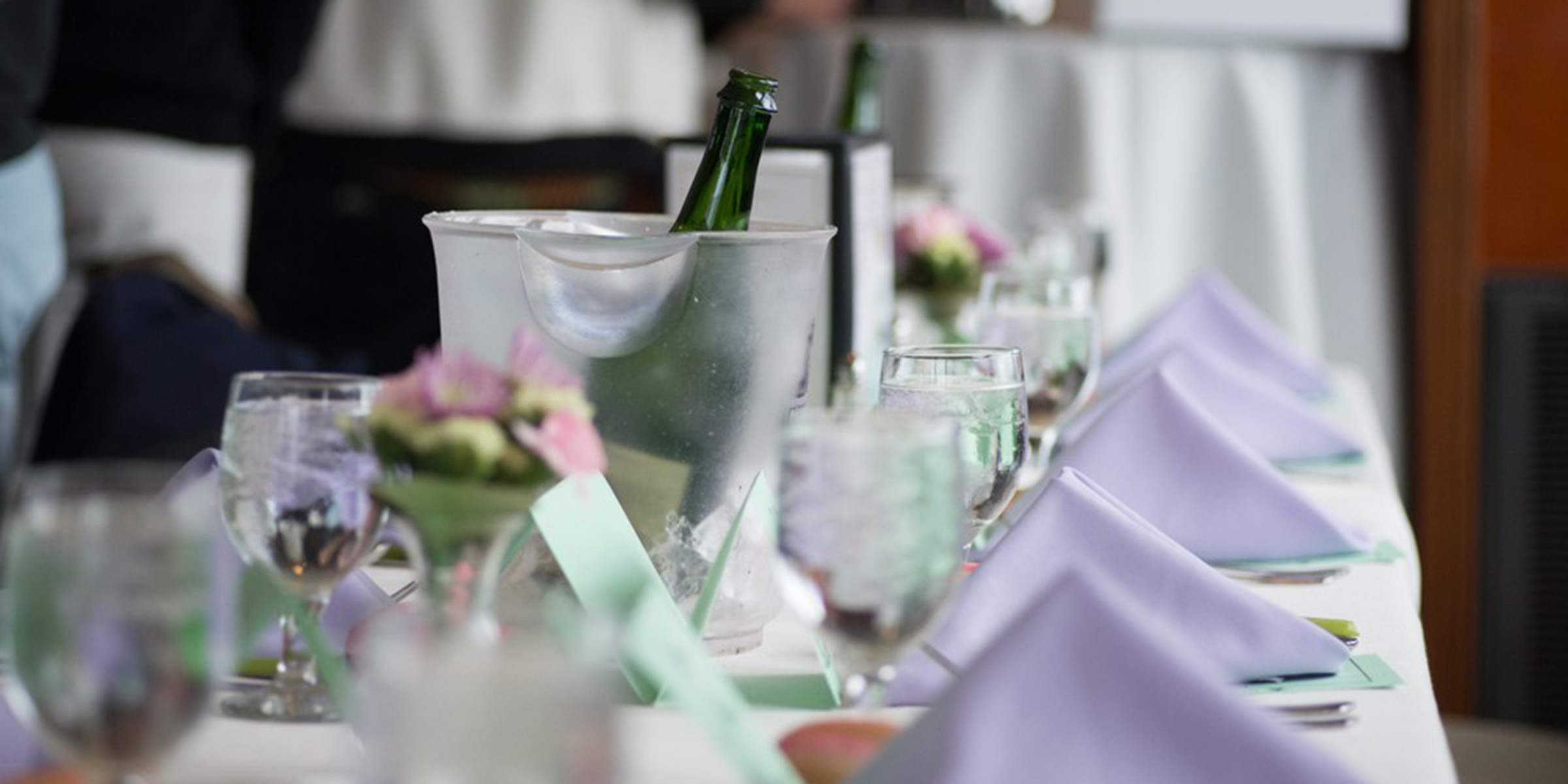 table setting with purple napkins