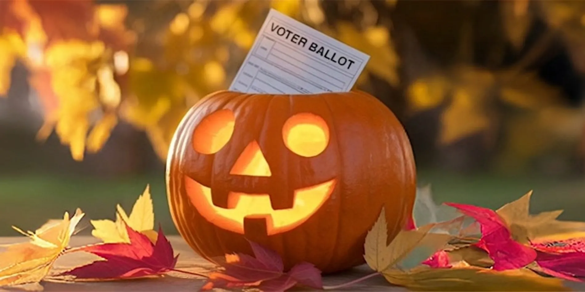 jack-o-lantern with voting ballot