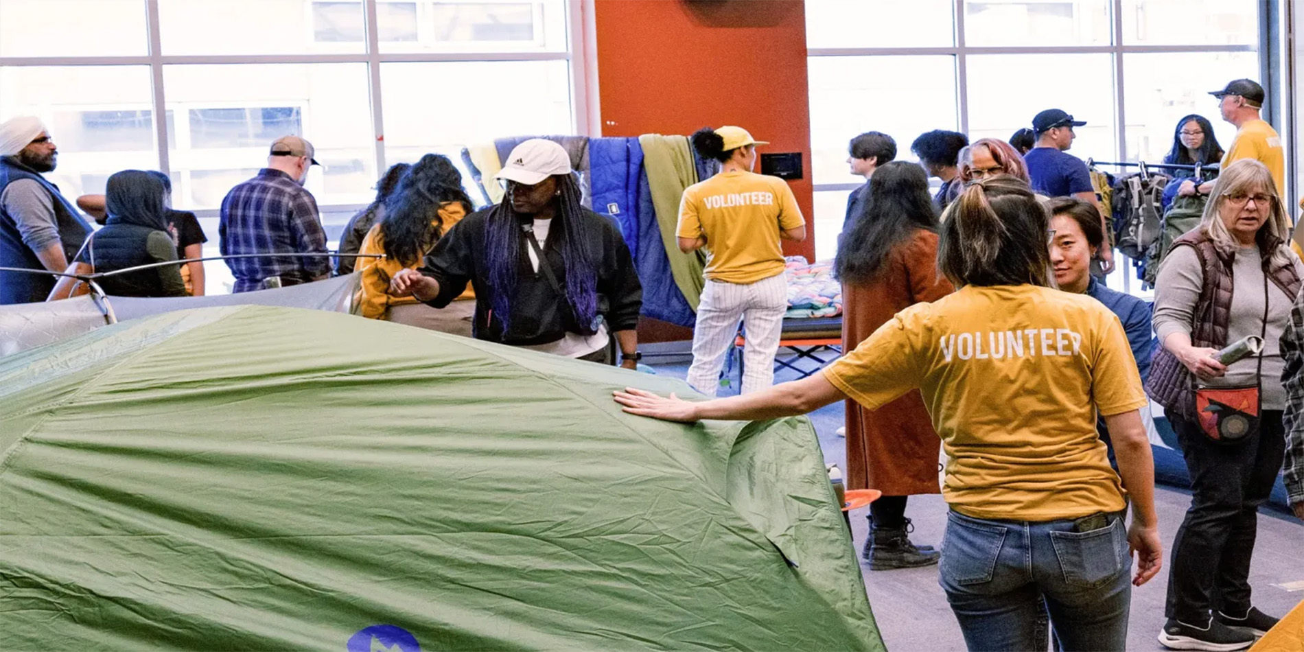people showcasing camping equipment