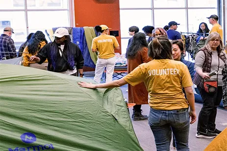 people showcasing camping equipment
