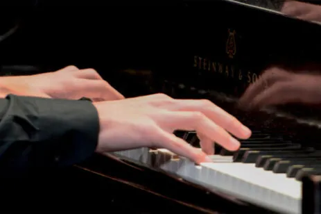 hands playing piano