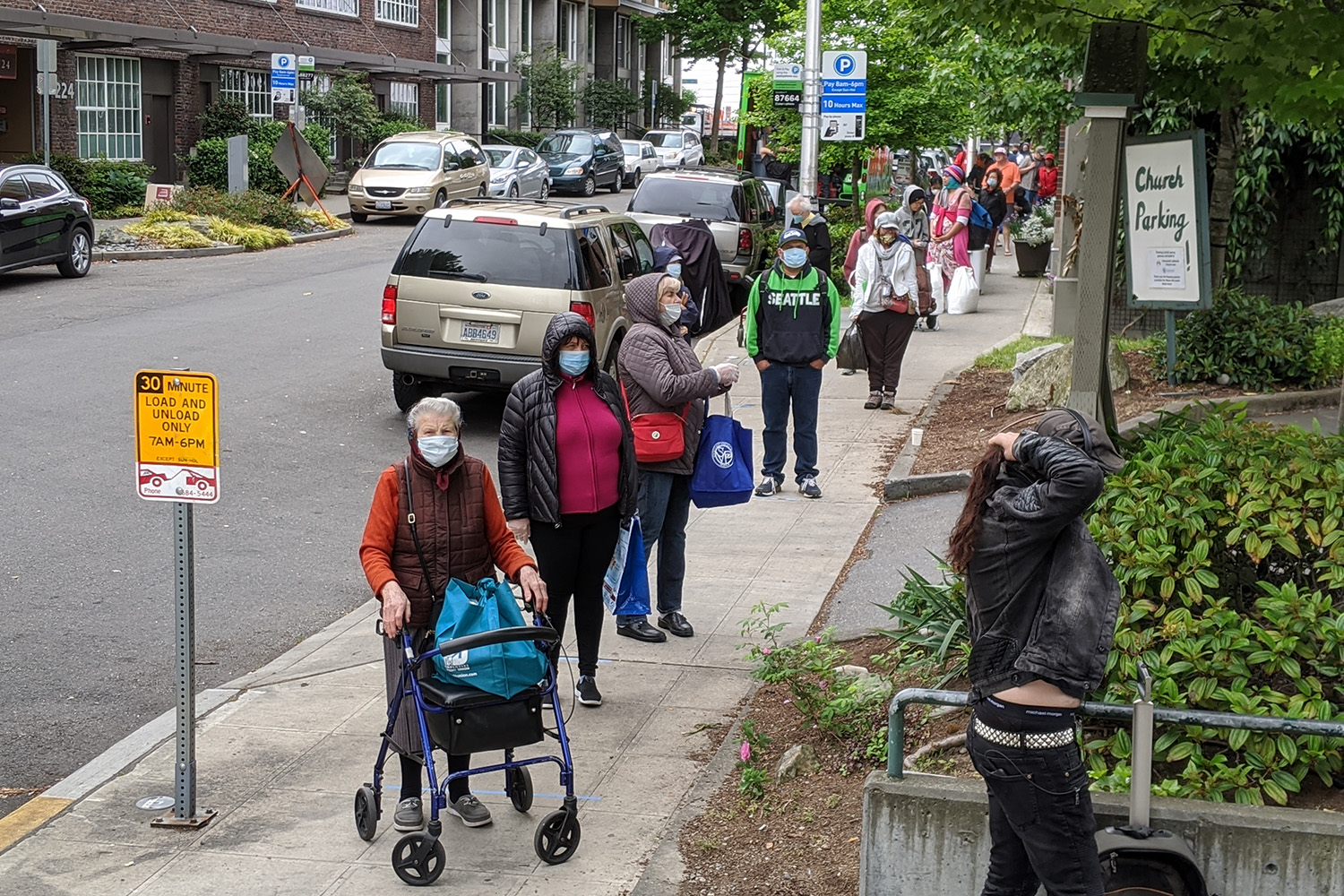 people waiting in line at food bank