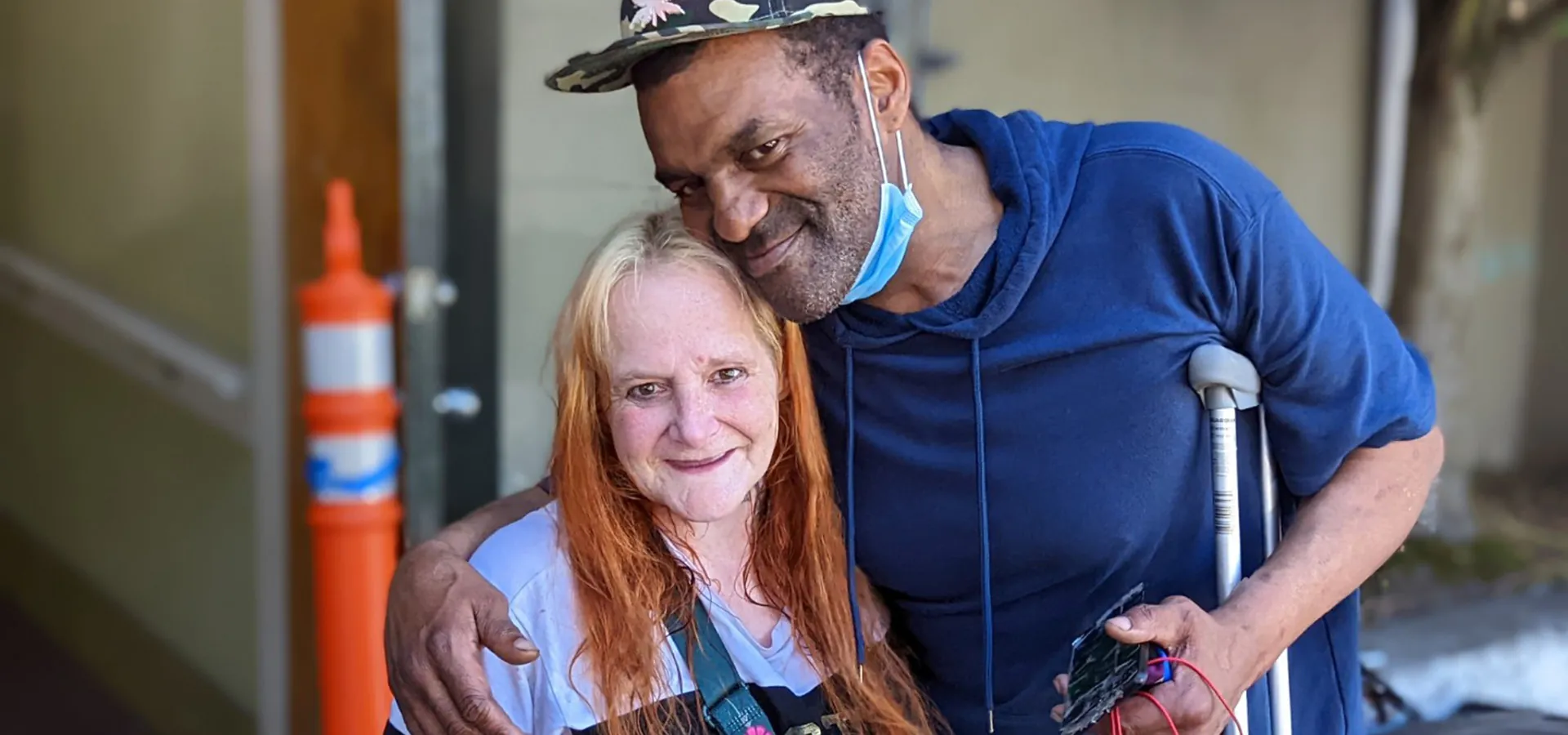 one person embracing another