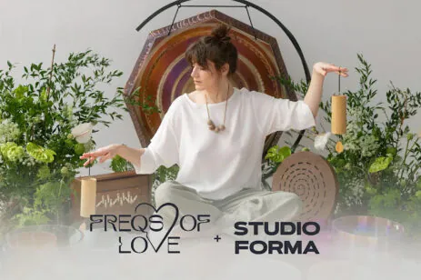person with sound bath equipment