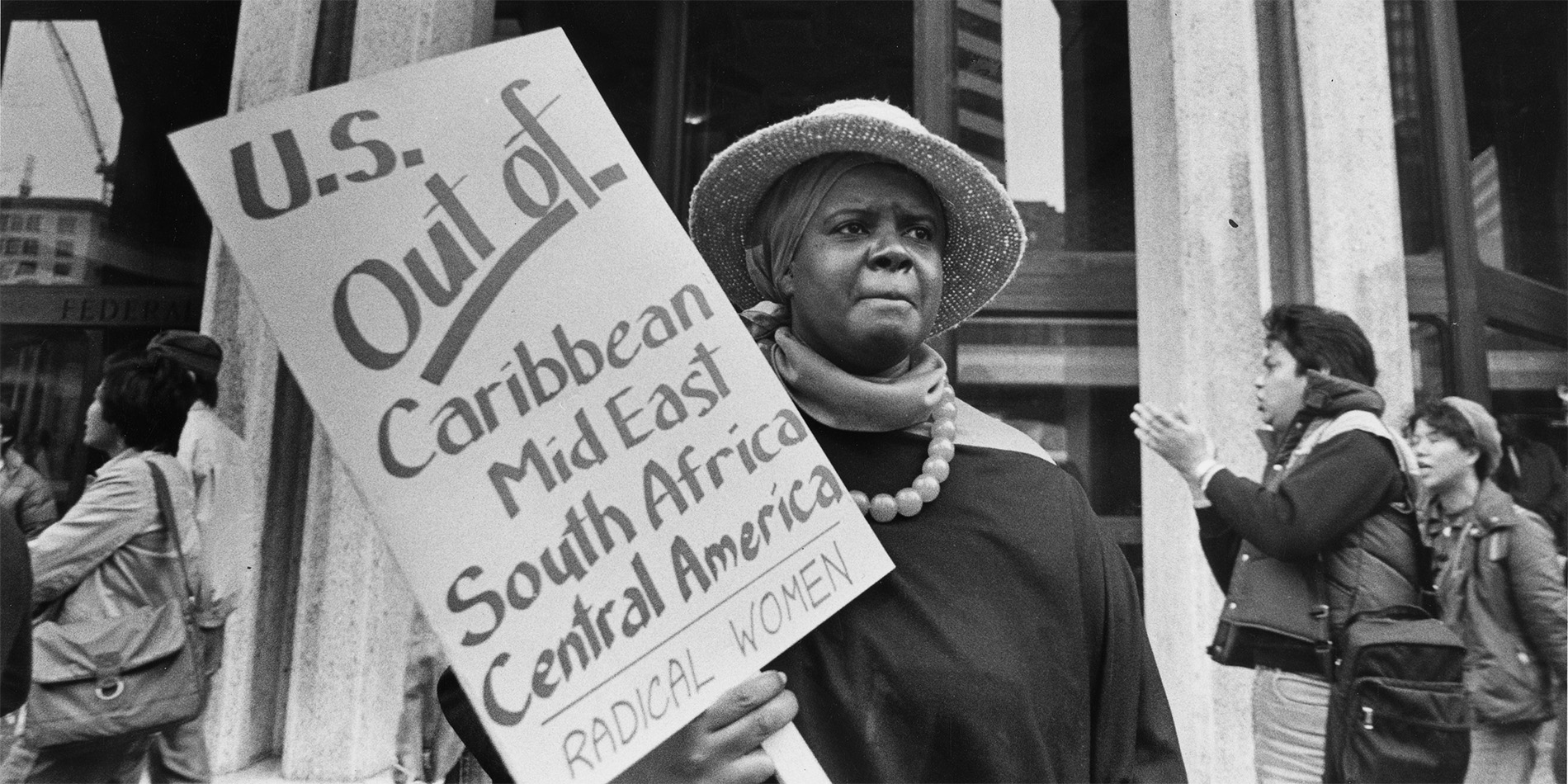 person holding protest sign