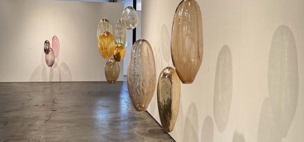Modern art display of hanging glass bubbles.