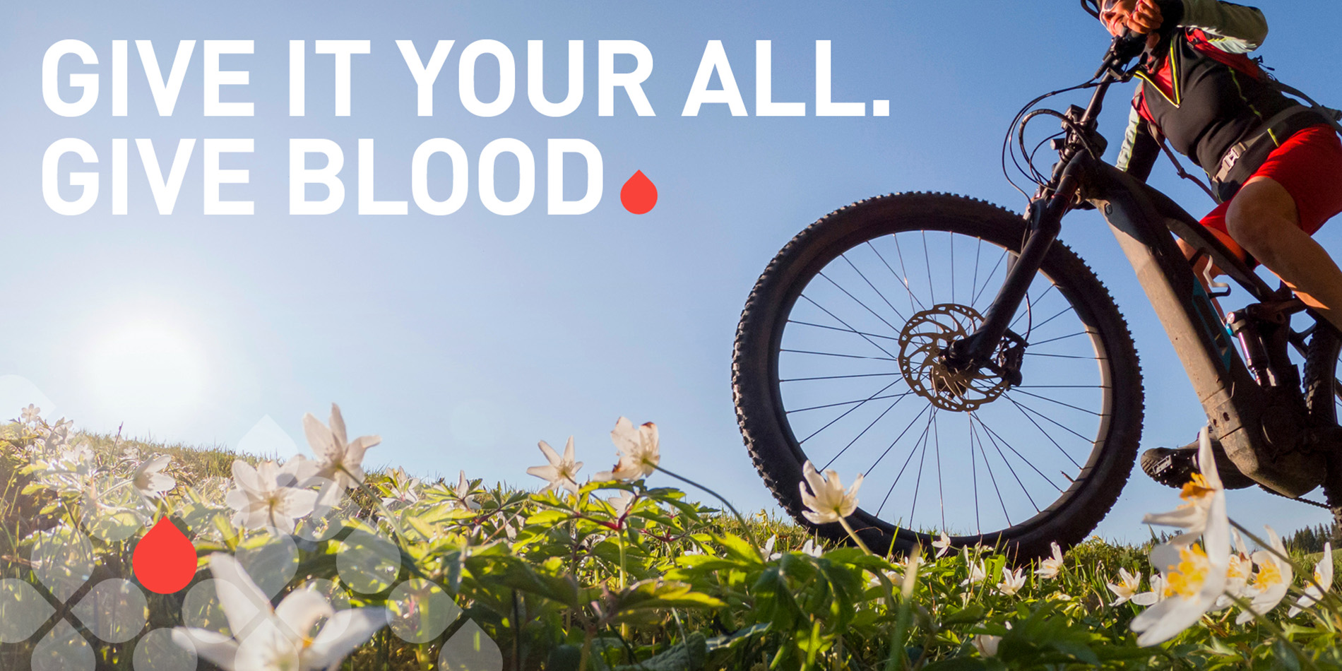 person riding bike with slogan