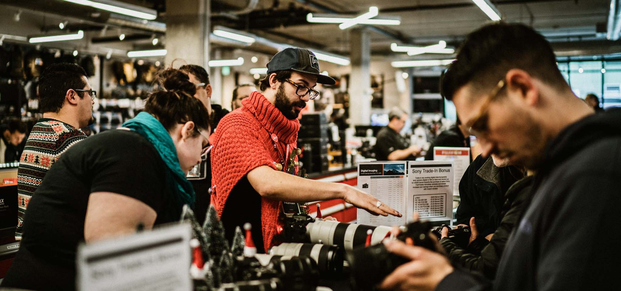 People shopping in a camera and photography shop.