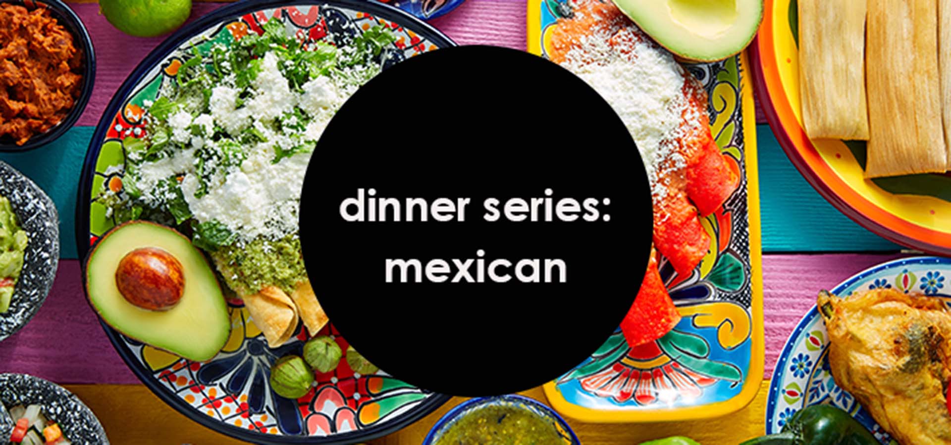 Colorful Mexican dinner spread on a table.