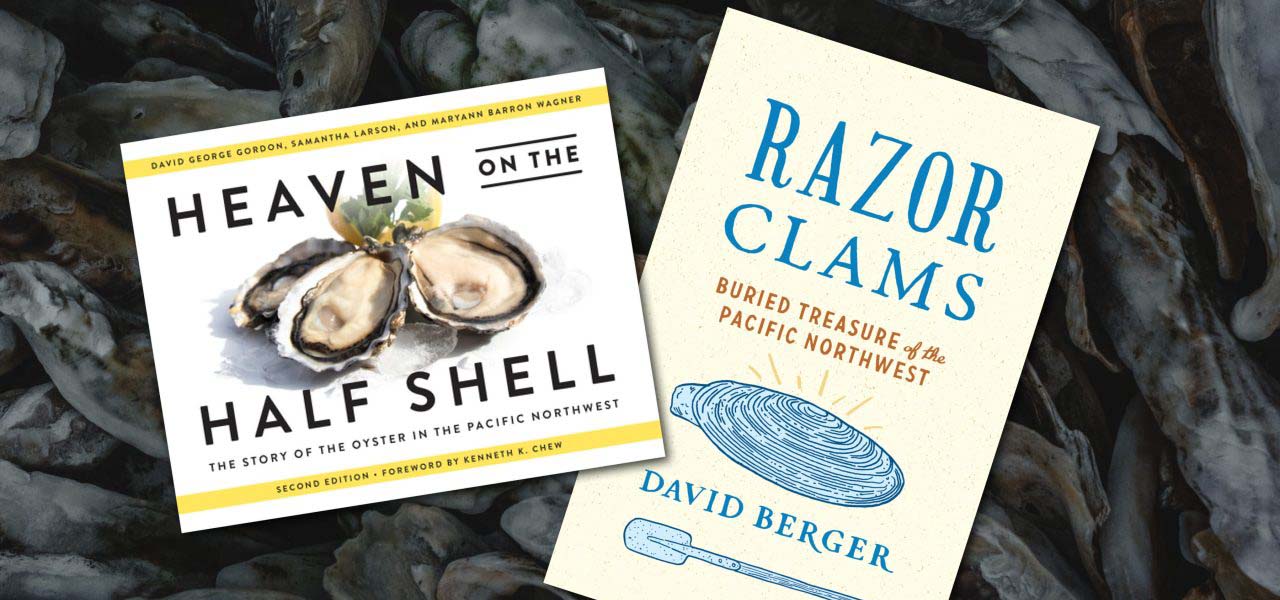 Books resting on top of clam shells.