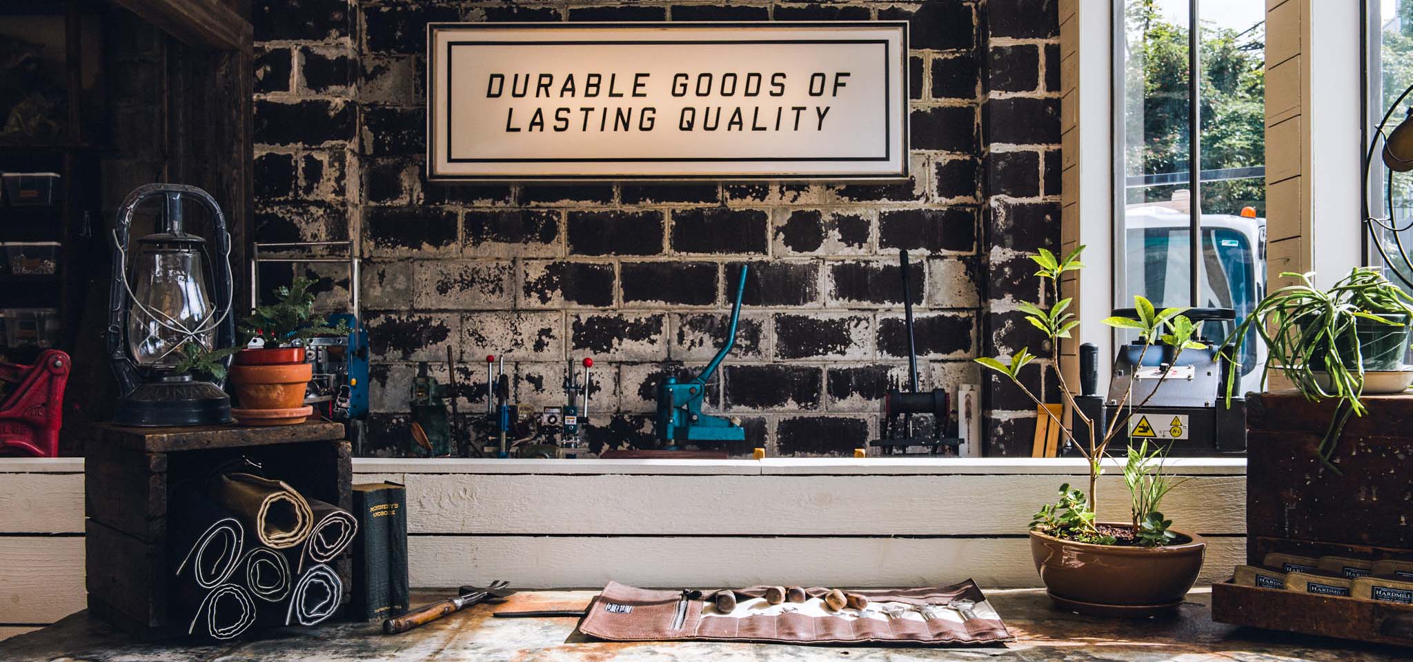 Interior of Hardmill shop, with leather goods, tools, and complimentary products.