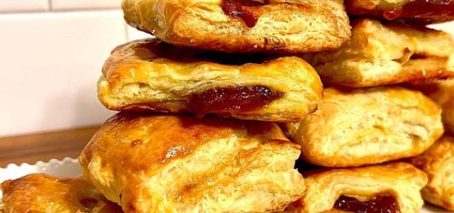 Stacked pastelitos, which is a Cuban puff pastry stuffed with guava and/or cheese.
