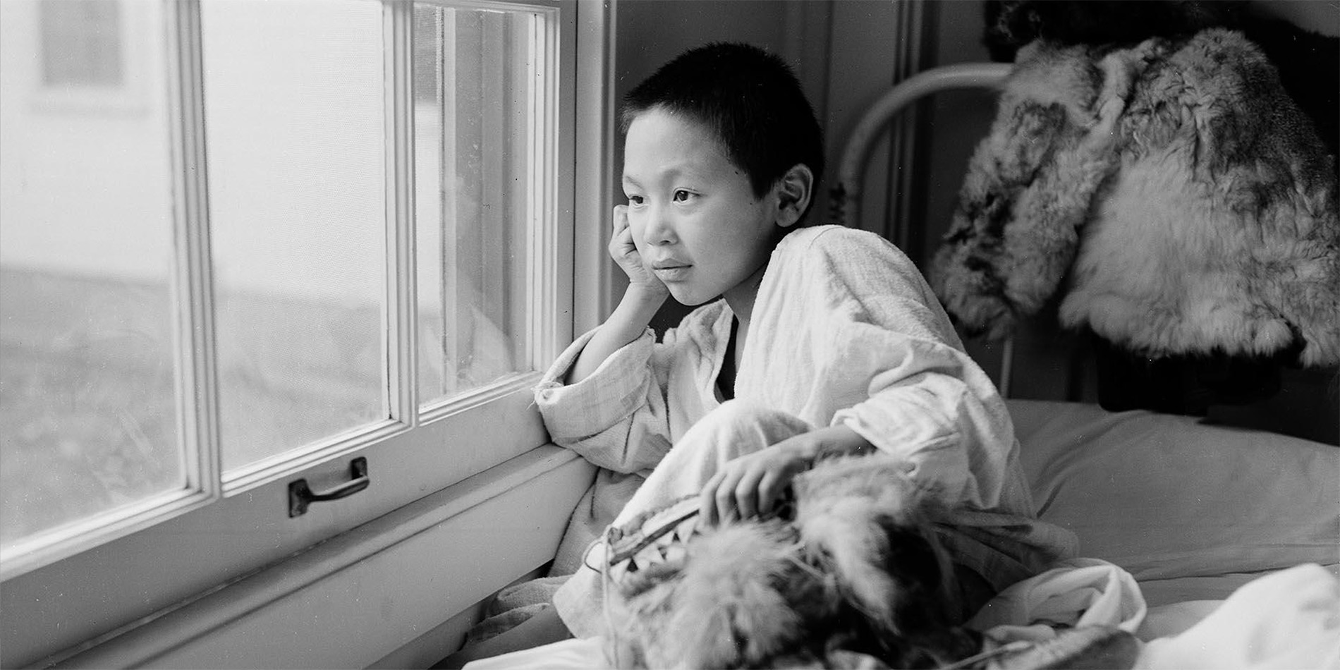 child looking out window