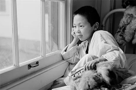 child looking out window