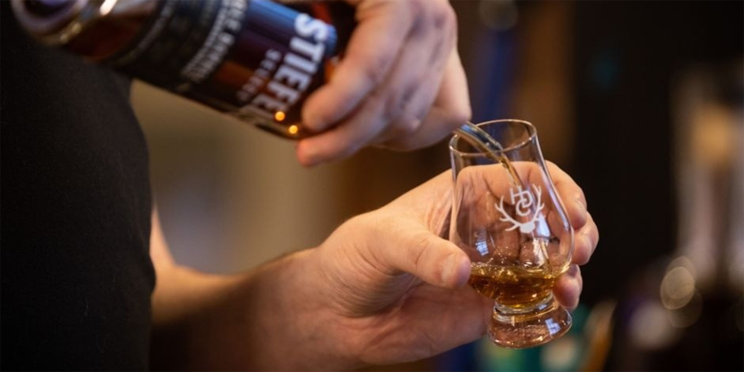 person pouring alcohol