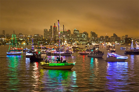 cruise ships on lake with holiday lights