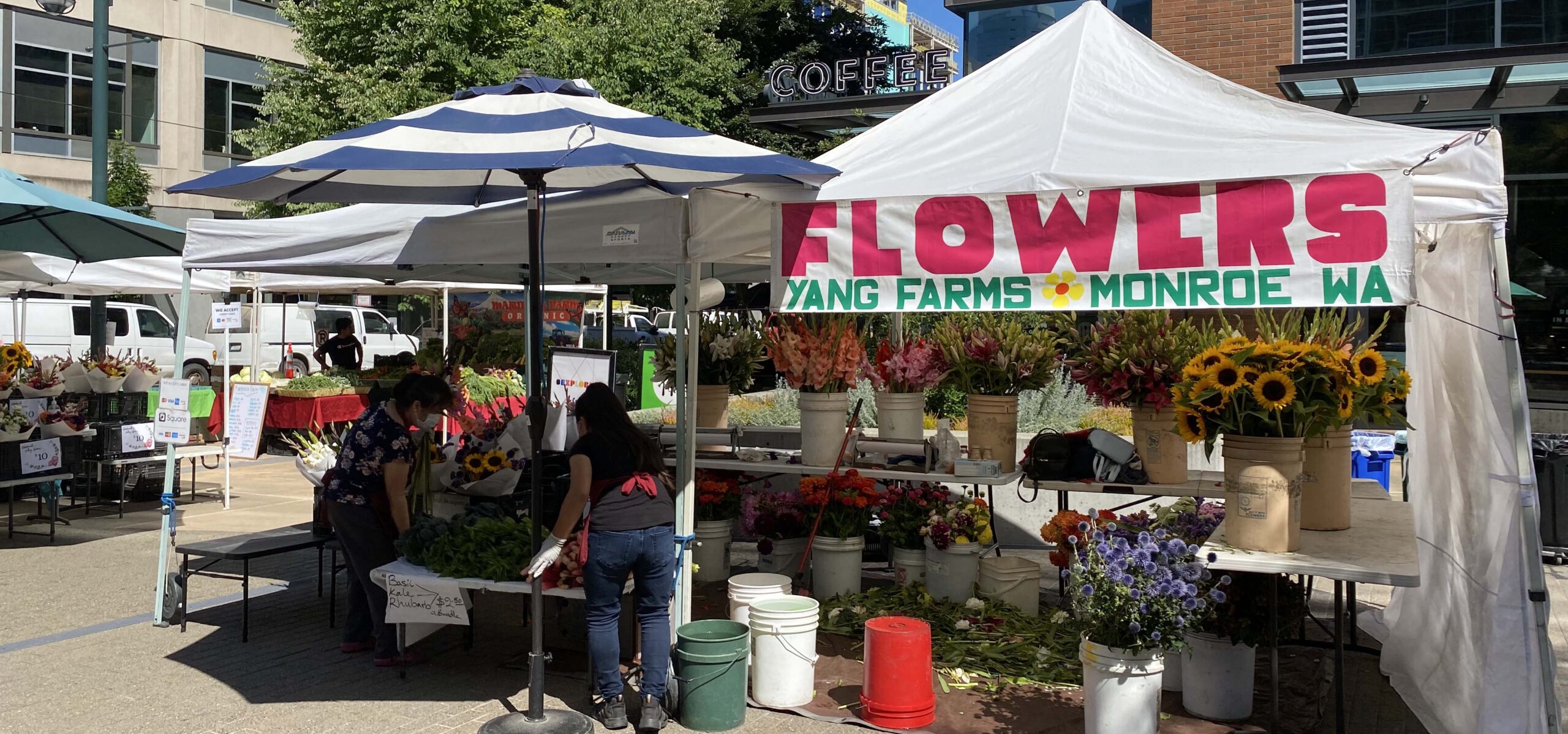 A flower stand at a local farmer's market.