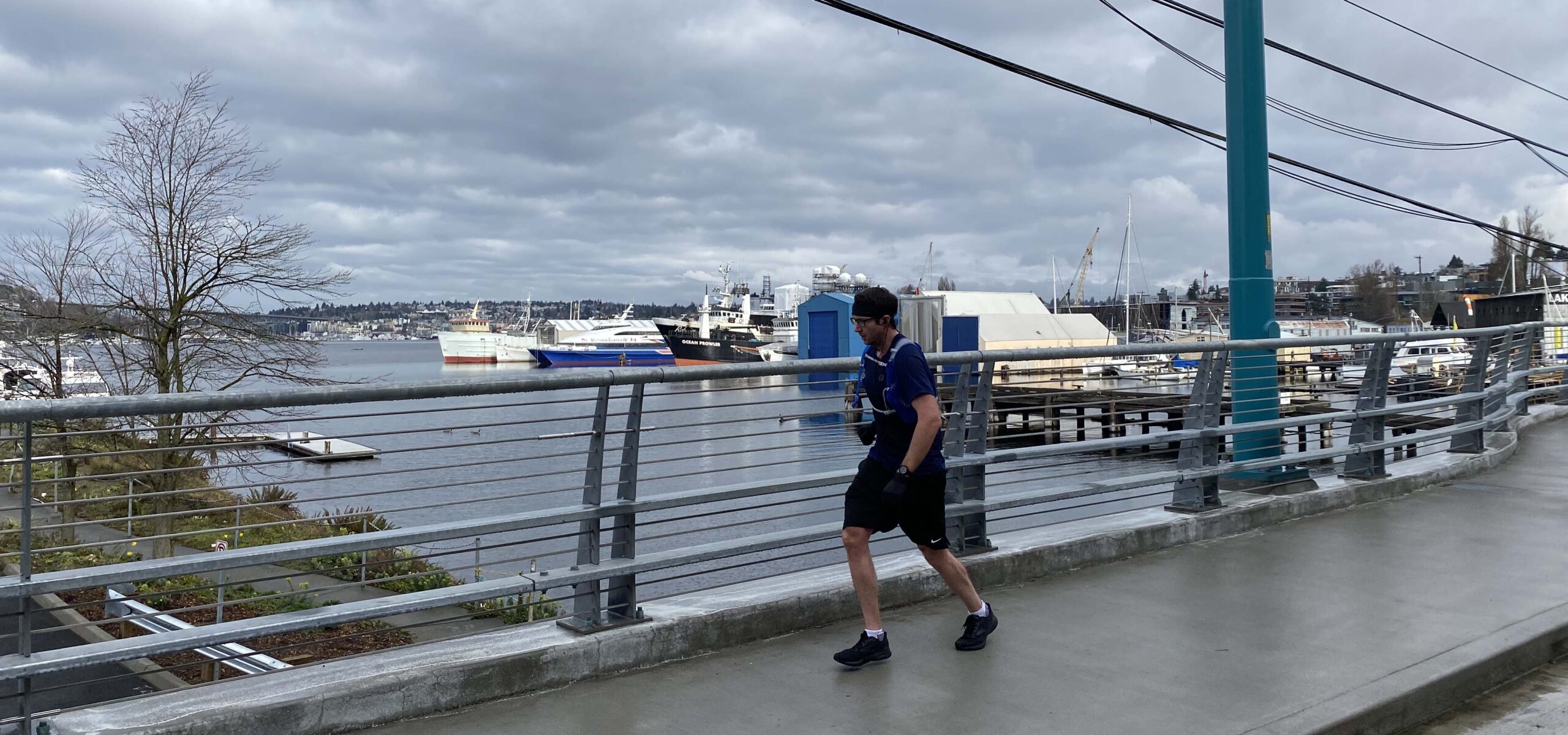 Jogger on a bridge over South Lake Union.